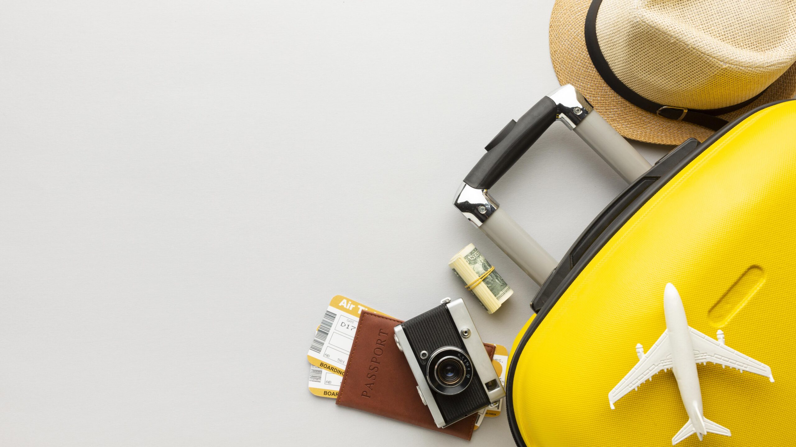 flat-lay-yellow-luggage-with-copy-space-min